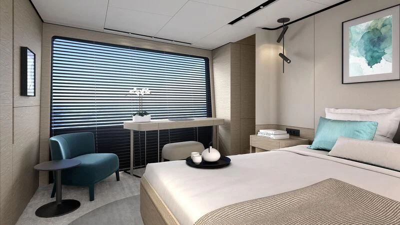 a room with a bed and a desk aboard WATERLILY Yacht for Sale