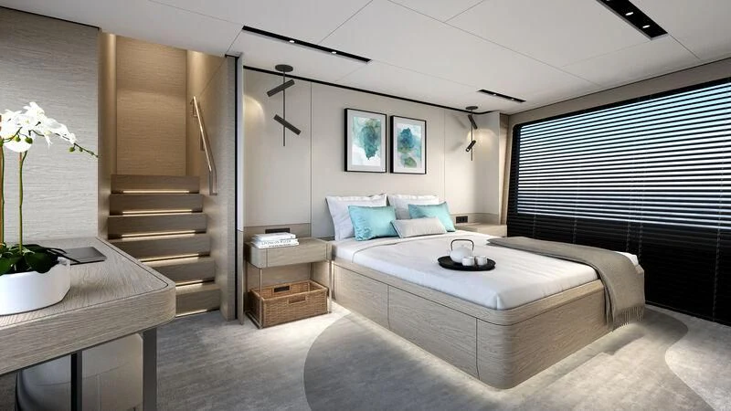 a modern bedroom with a large bed aboard WATERLILY Yacht for Sale