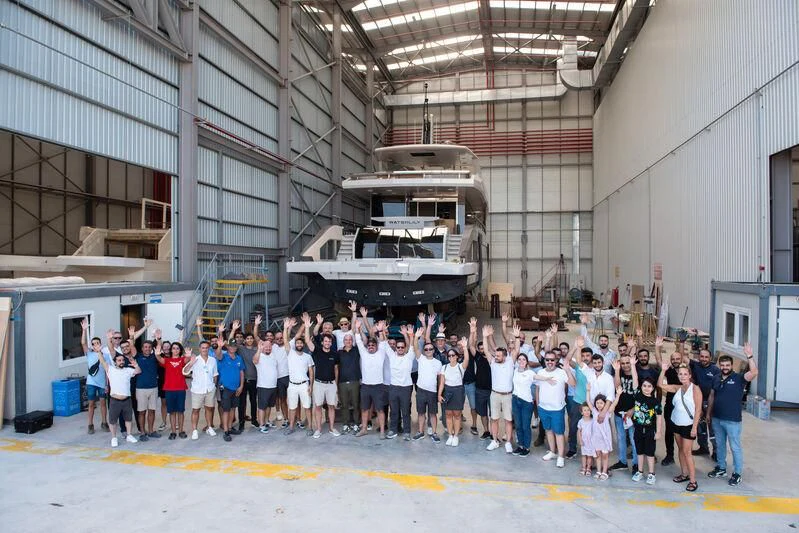 a group of people posing for a photo aboard WATERLILY Yacht for Sale