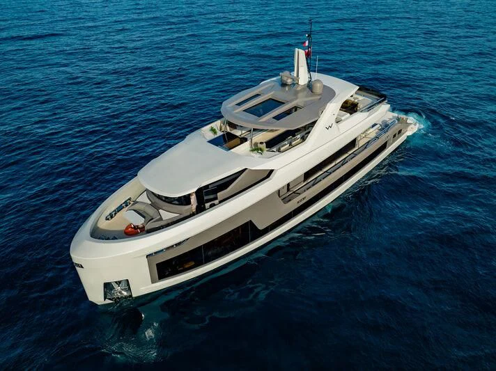 a white yacht on the water aboard WATERLILY Yacht for Sale
