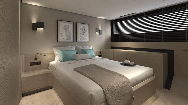 a bed with a white bed spread aboard WATERLILY Yacht for Sale