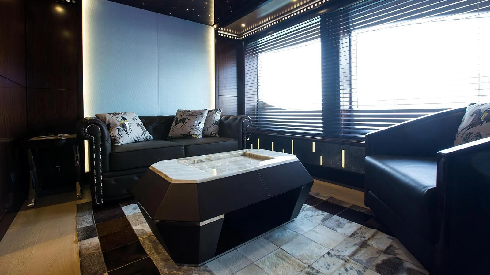 a living room with a couch and a table aboard MY ESCAPE Yacht for Sale
