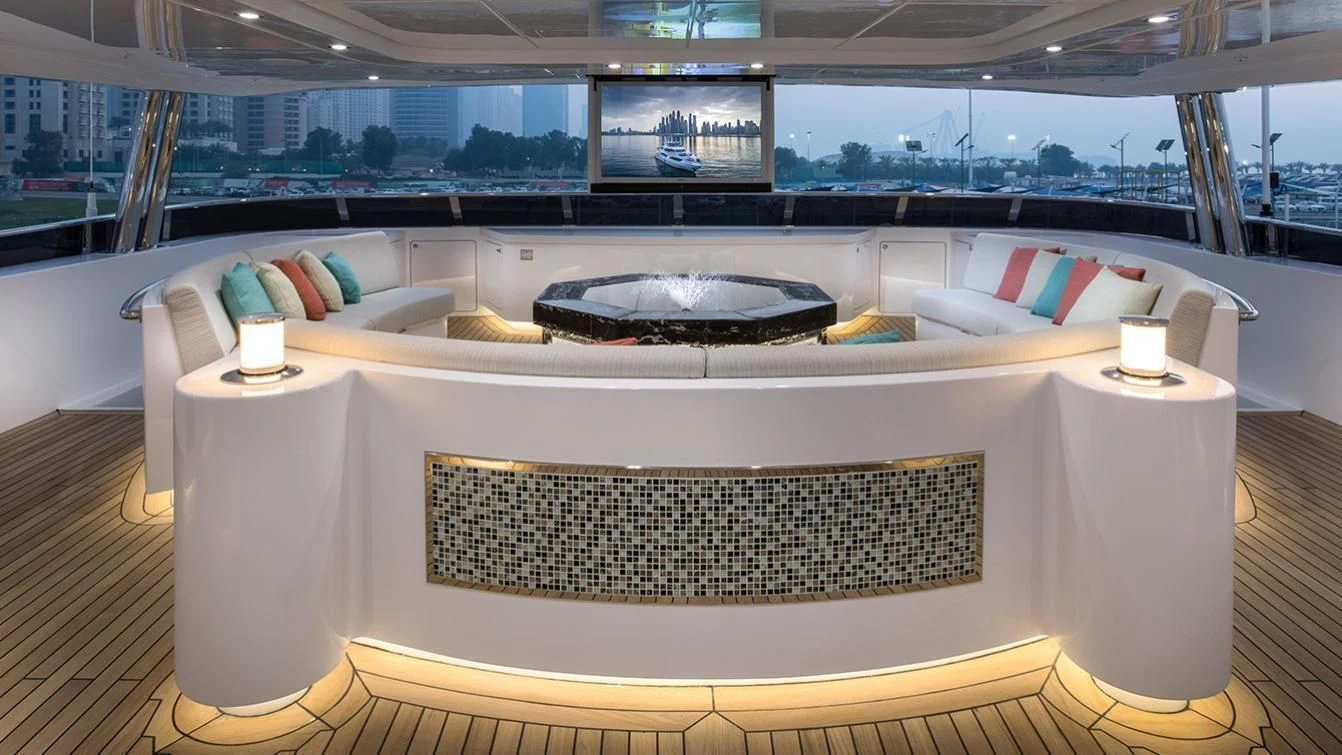 a white table with a white tablecloth and a white chair with a white tablecloth with a aboard MY ESCAPE Yacht for Sale