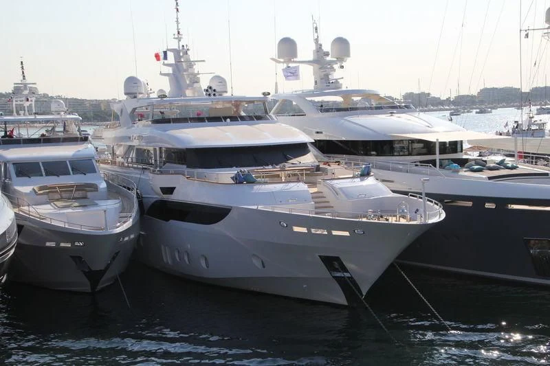 a group of boats are parked in a harbor aboard MY ESCAPE Yacht for Sale