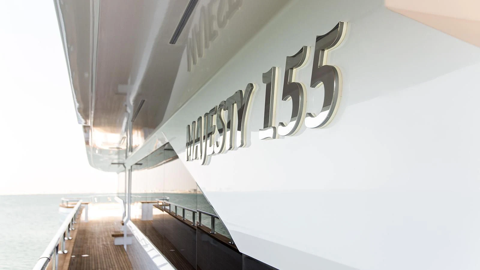a white building with a large sign aboard MY ESCAPE Yacht for Sale