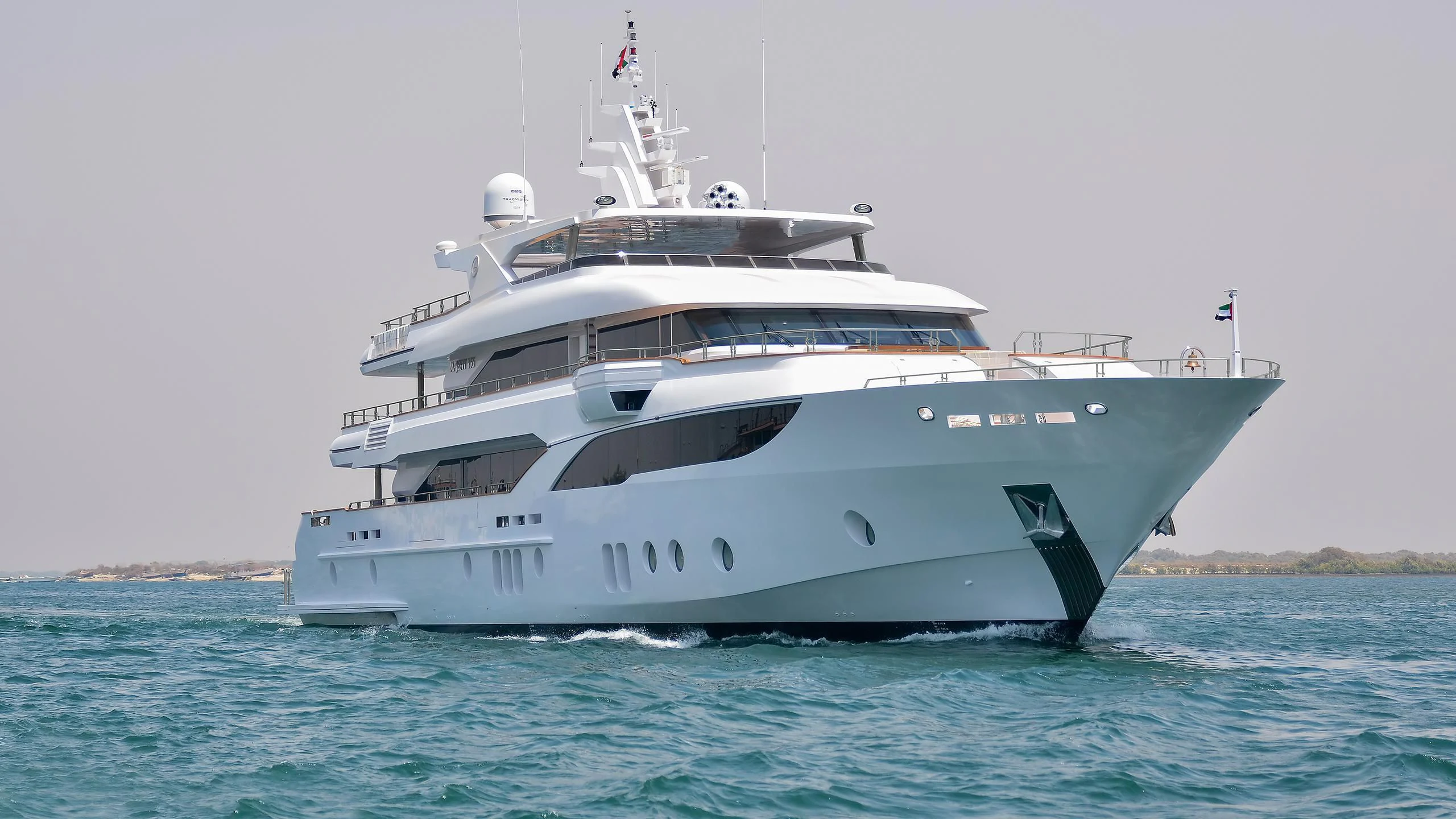 a large white boat in the water aboard MY ESCAPE Yacht for Sale