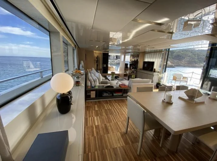 a room with a table and chairs aboard ENSO 4 Yacht for Sale