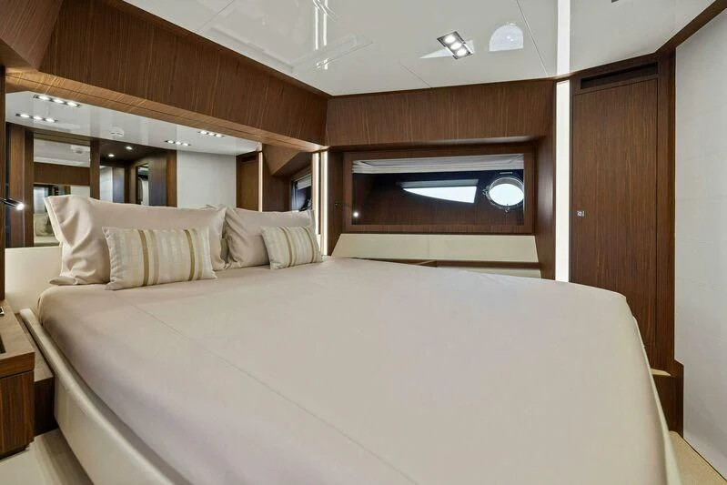 a bed with a white sheet aboard INDISCRETION Yacht for Sale