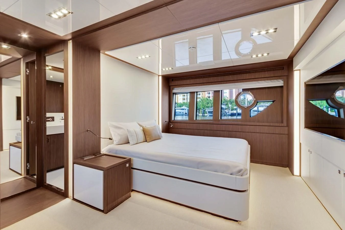 a room with a bed and a desk aboard INDISCRETION Yacht for Sale