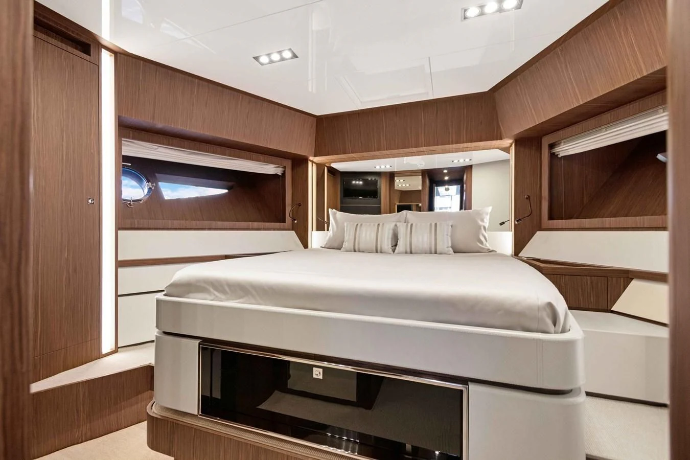 a room with a bed and a television aboard INDISCRETION Yacht for Sale