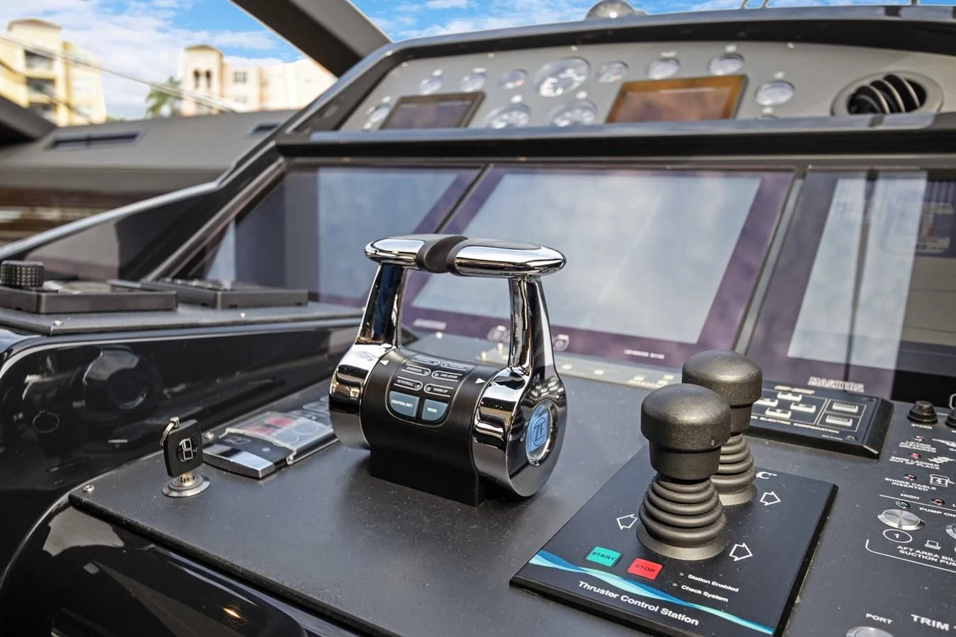 a car with a steering wheel aboard INDISCRETION Yacht for Sale