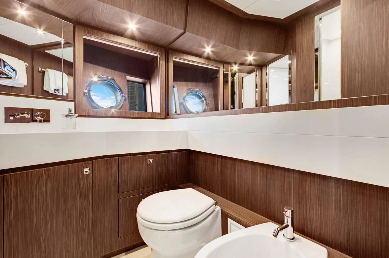 a bathroom with a toilet and a sink aboard INDISCRETION Yacht for Sale