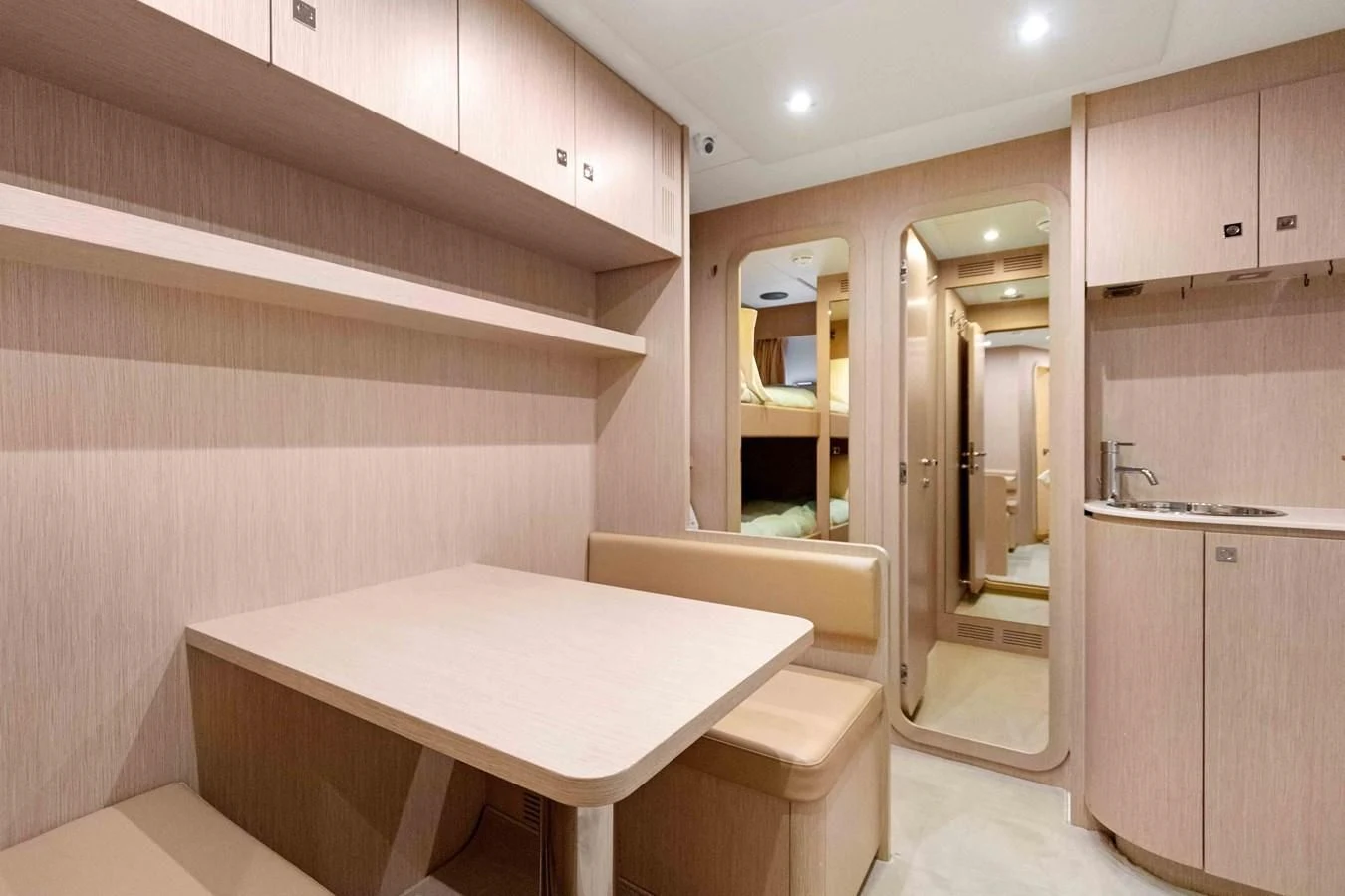 a bathroom with a table and a mirror aboard INDISCRETION Yacht for Sale