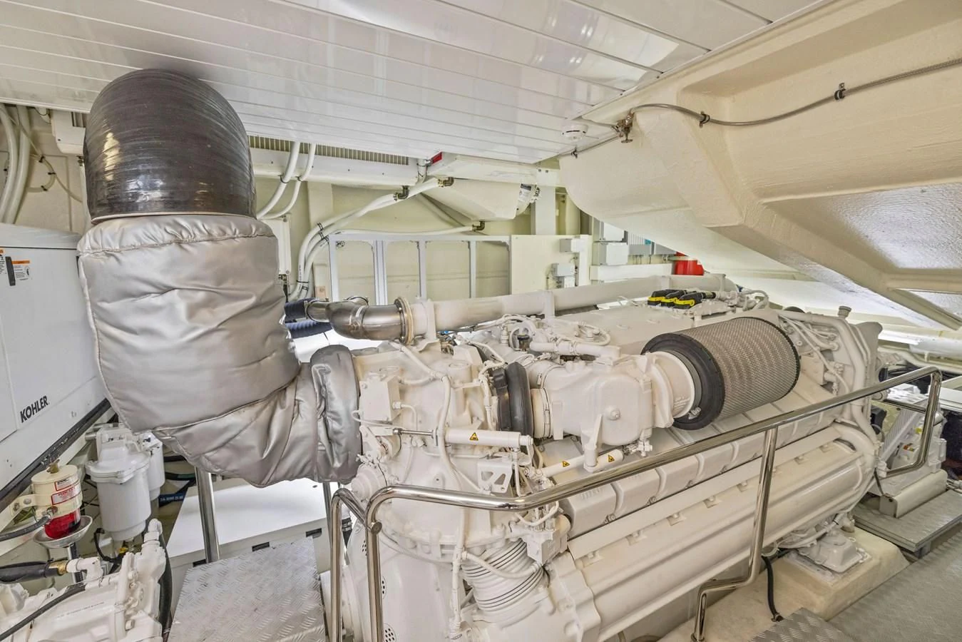 a person in a room with white walls and pipes aboard INDISCRETION Yacht for Sale