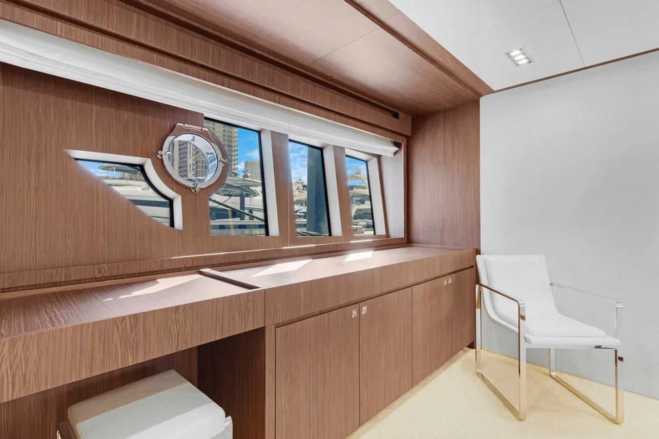 a room with a white chair and a white chair aboard INDISCRETION Yacht for Sale