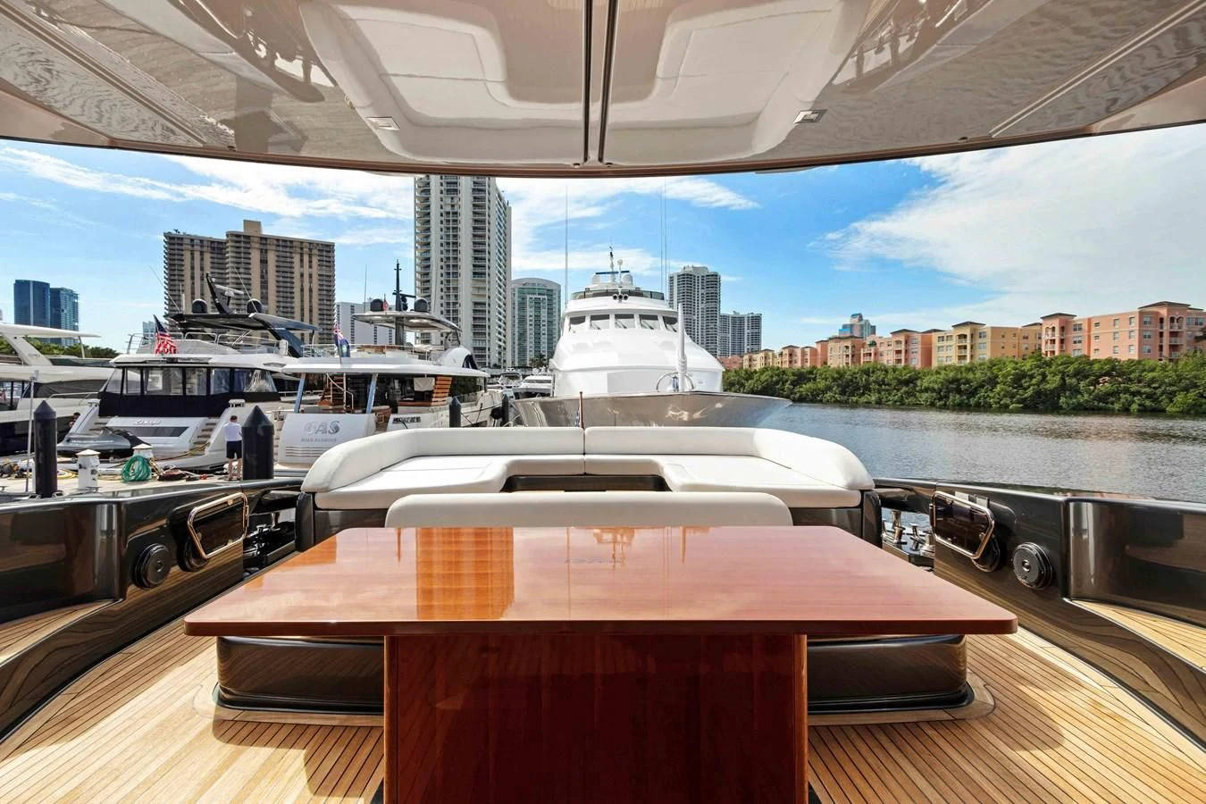 a table with a boat in the background aboard INDISCRETION Yacht for Sale