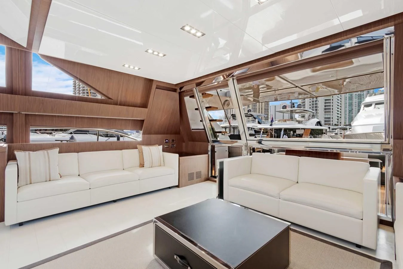 a room with couches and a table aboard INDISCRETION Yacht for Sale