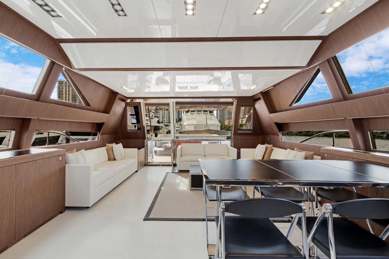 a room with a table and chairs aboard INDISCRETION Yacht for Sale