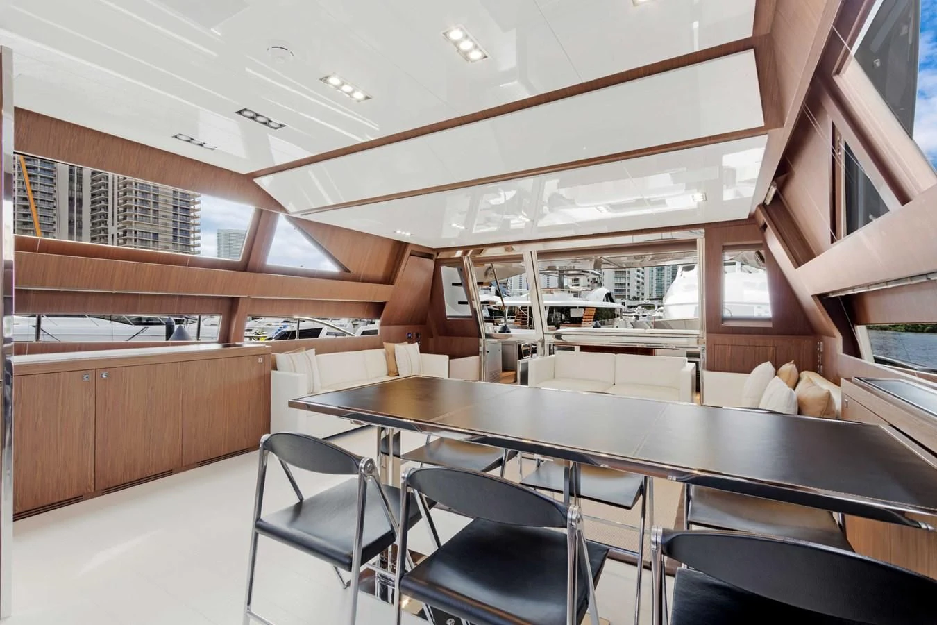 a room with a table and chairs aboard INDISCRETION Yacht for Sale