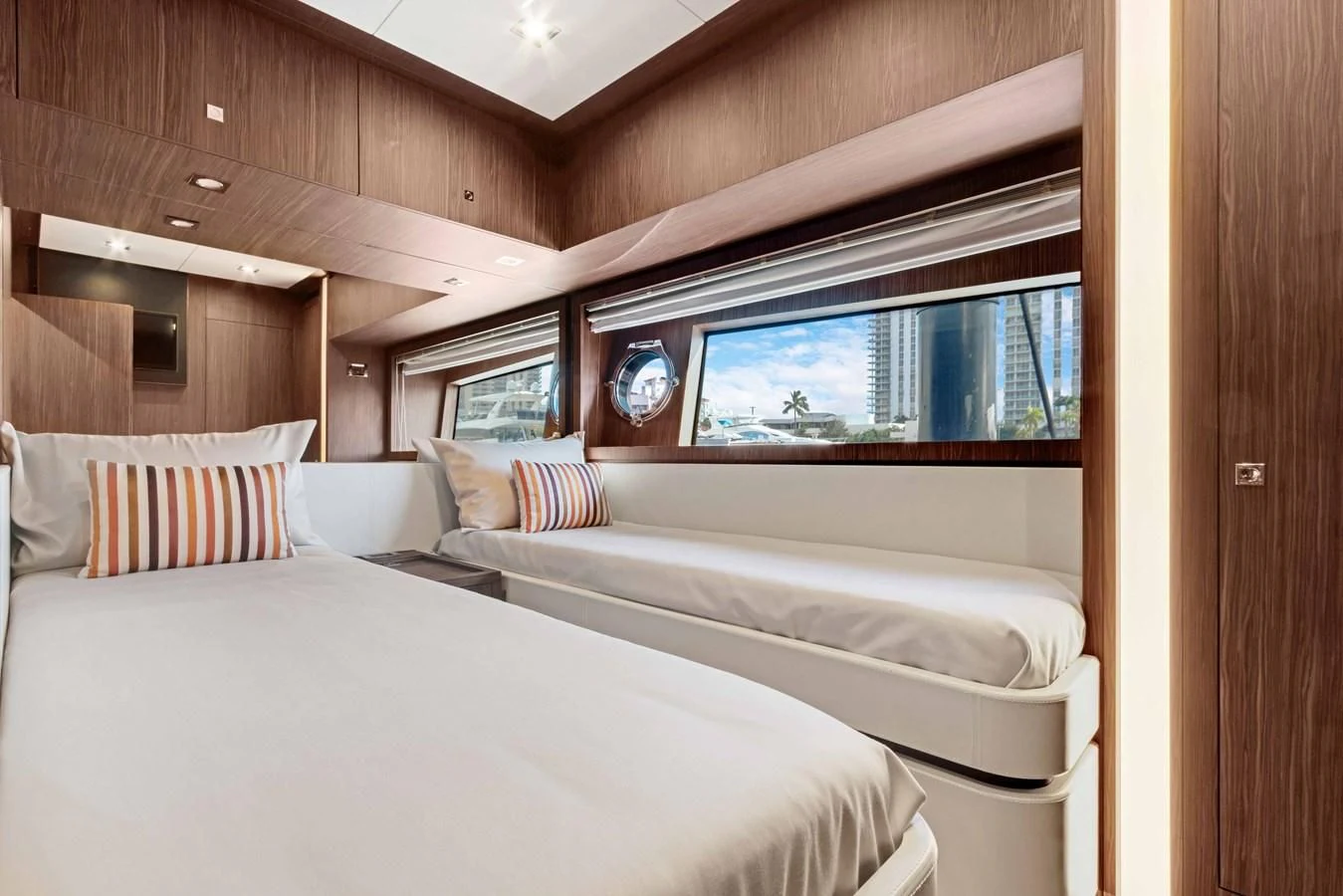 a room with two beds aboard INDISCRETION Yacht for Sale
