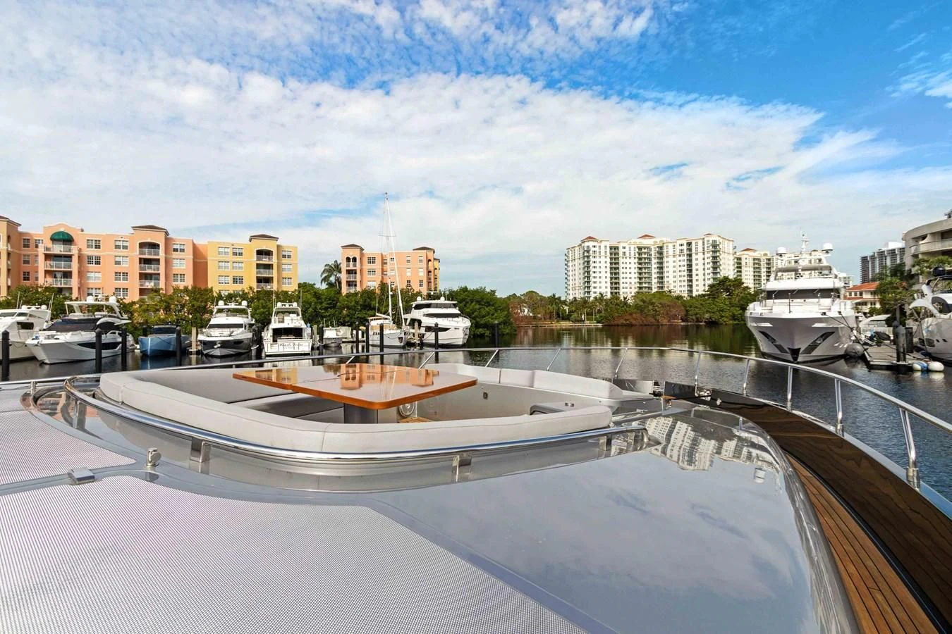 a large pool of water with boats in it and buildings in the background aboard INDISCRETION Yacht for Sale