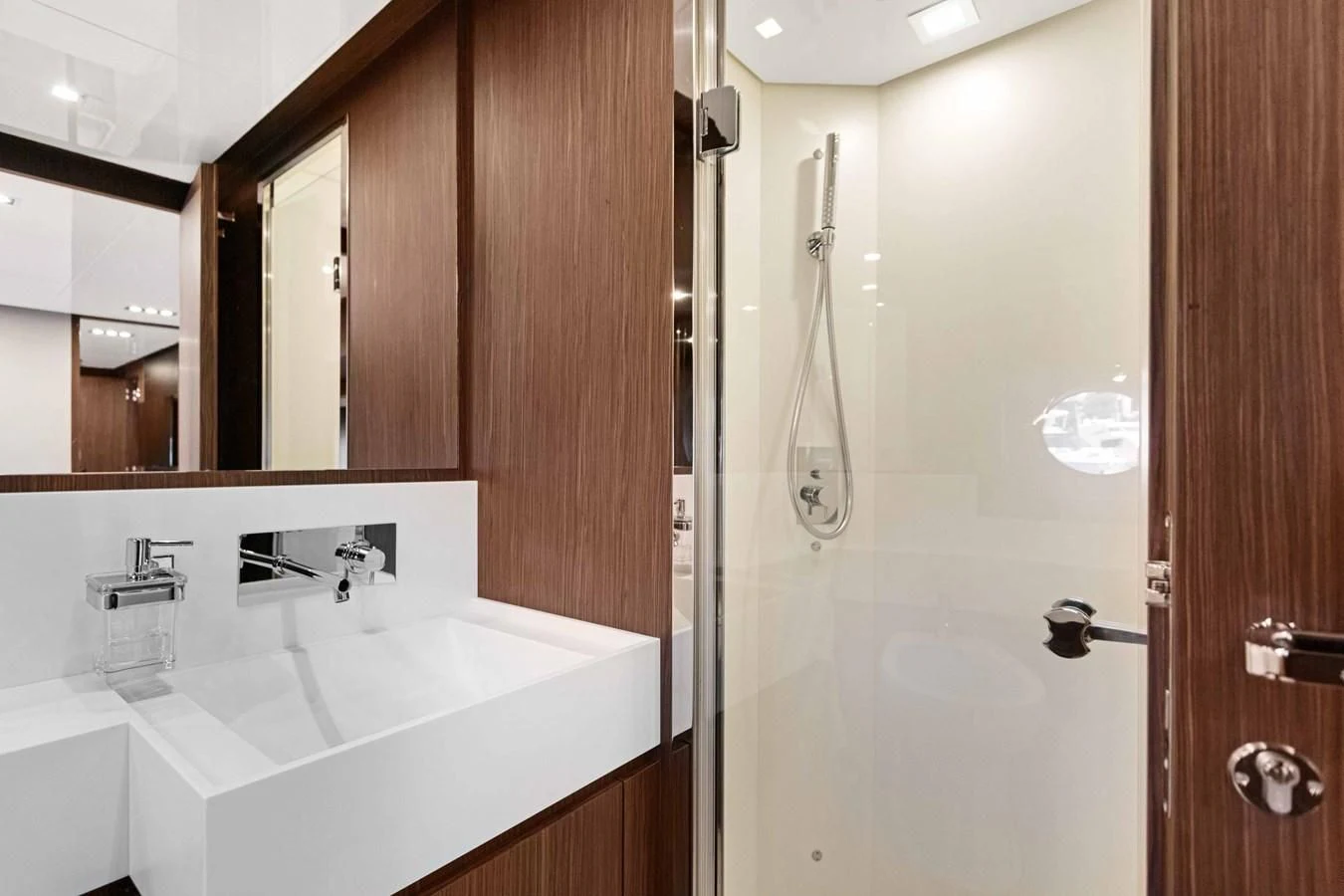 a bathroom with a sink and a mirror aboard INDISCRETION Yacht for Sale