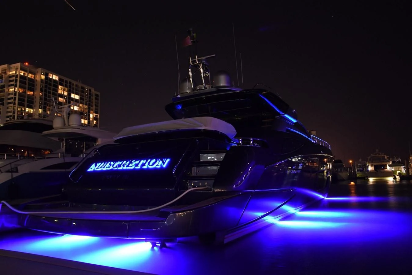a car with lights on aboard INDISCRETION Yacht for Sale