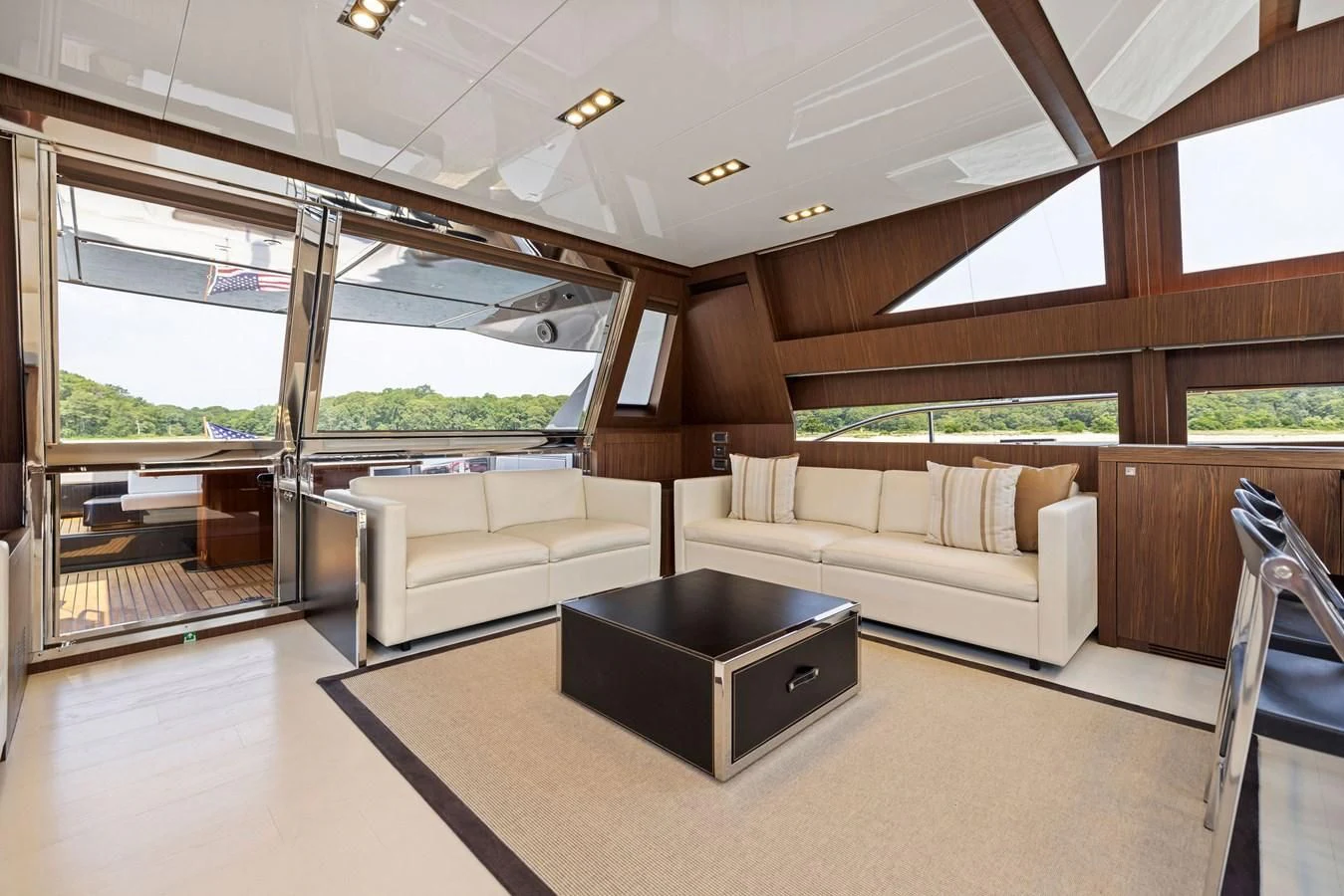 a living room with a large window aboard INDISCRETION Yacht for Sale