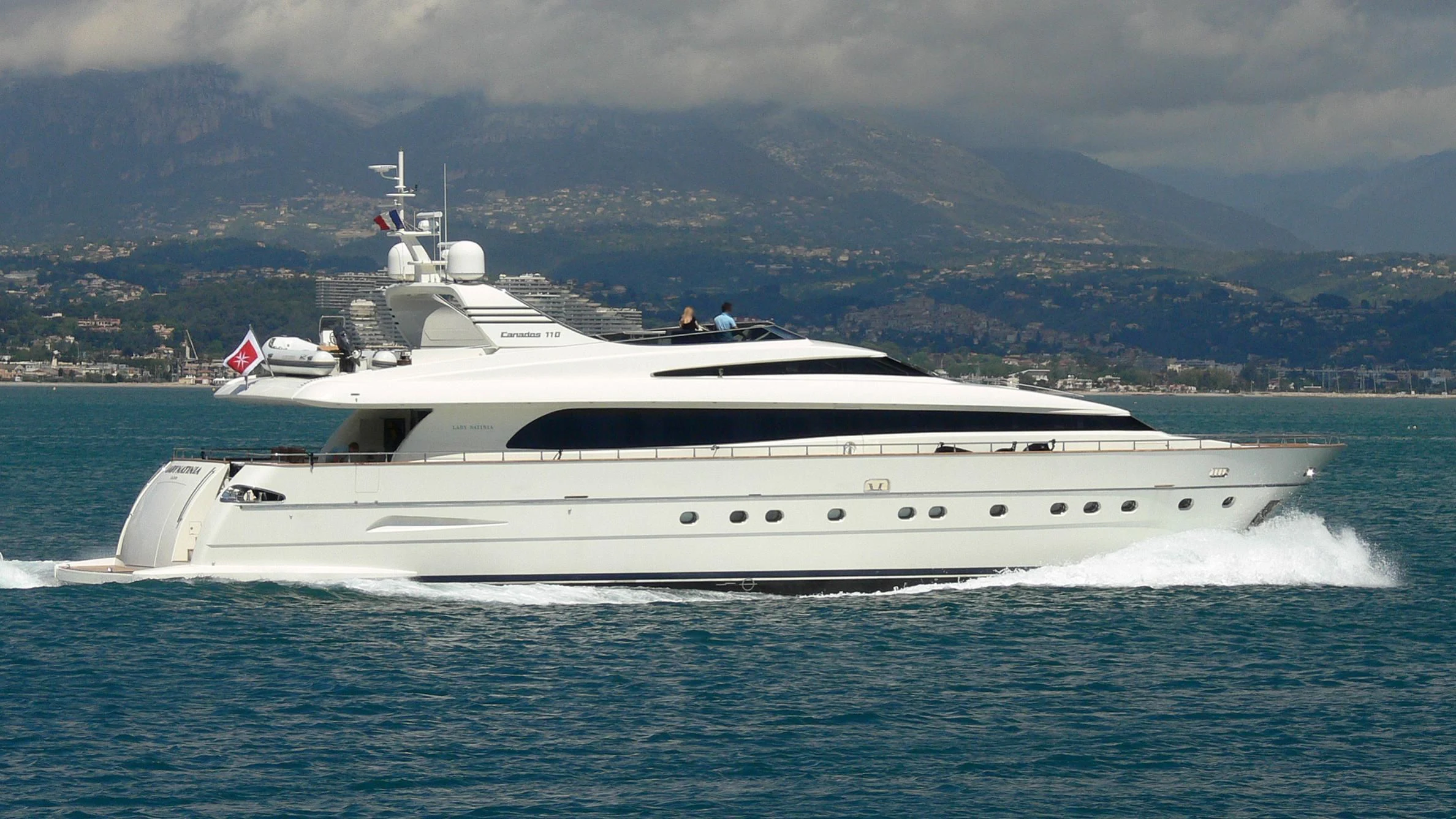 a white yacht in the water aboard L'AYAZULA Yacht for Sale