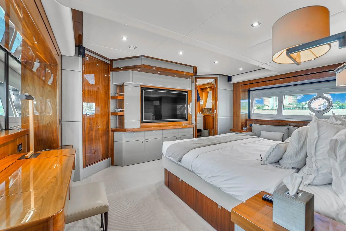 a bedroom with a bed and a tv aboard 92' SUNSEEKER 2016 Yacht for Sale