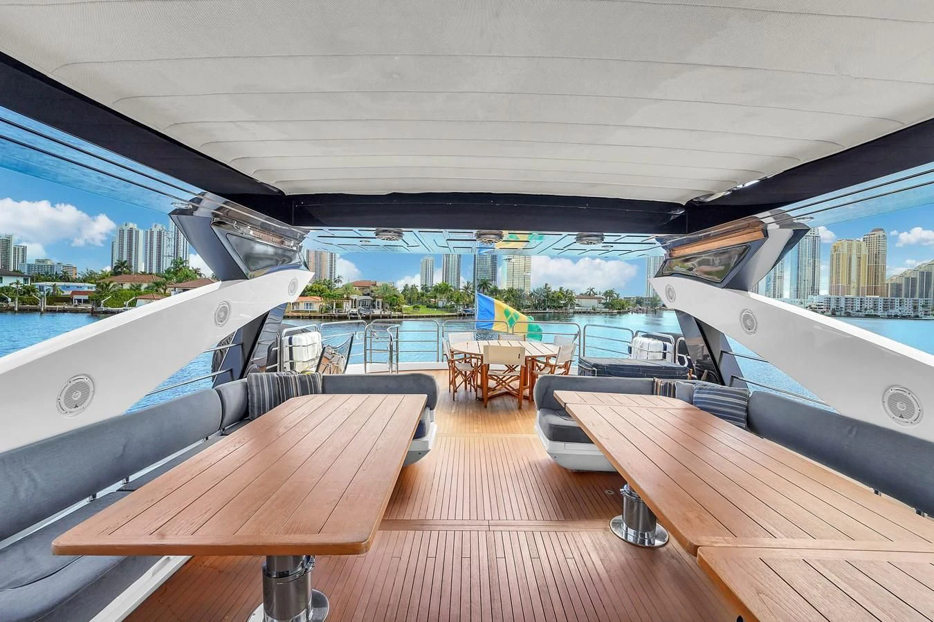 a deck with a view of a city and a body of water aboard 92' SUNSEEKER 2016 Yacht for Sale
