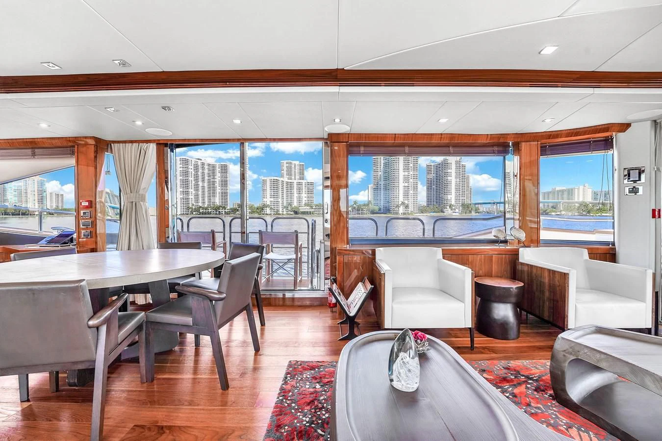 a room with a table and chairs aboard 92' SUNSEEKER 2016 Yacht for Sale
