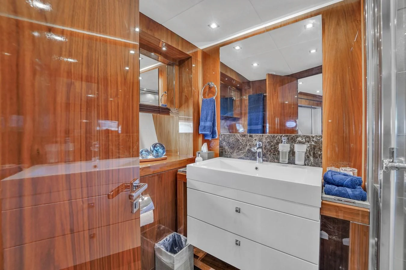 a bathroom with a wooden shower aboard 92' SUNSEEKER 2016 Yacht for Sale