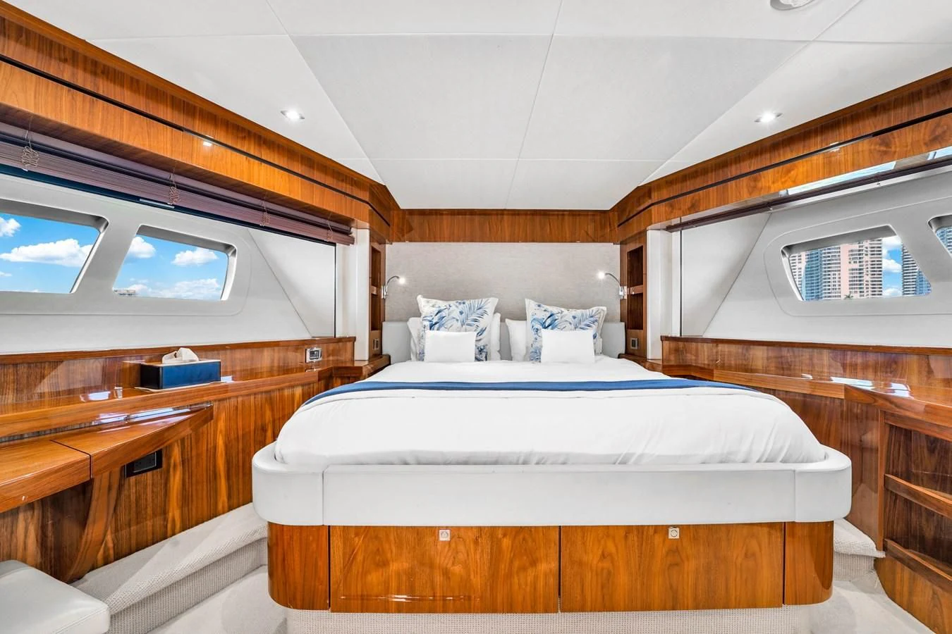 a room with a bed and a desk aboard 92' SUNSEEKER 2016 Yacht for Sale