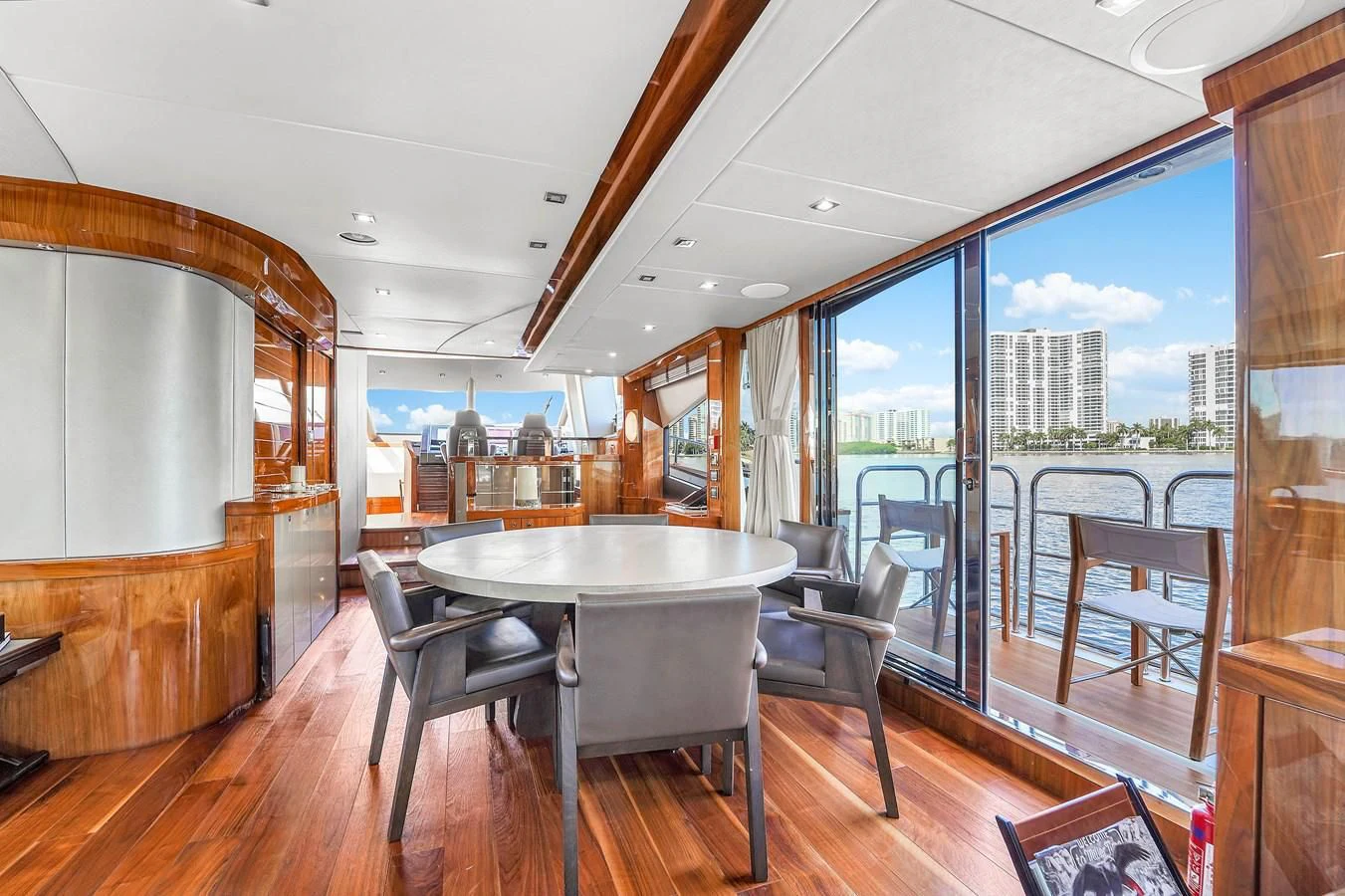a room with a table and chairs aboard 92' SUNSEEKER 2016 Yacht for Sale