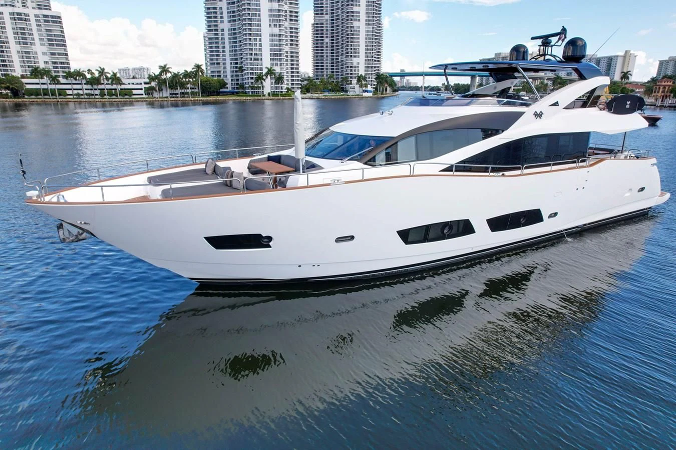 a white boat in a body of water aboard 92' SUNSEEKER 2016 Yacht for Sale
