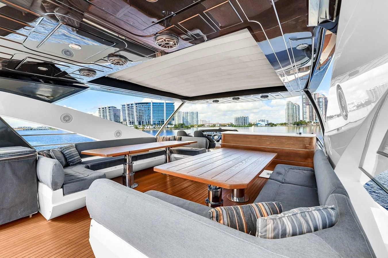 a room with a couch and a table aboard 92' SUNSEEKER 2016 Yacht for Sale