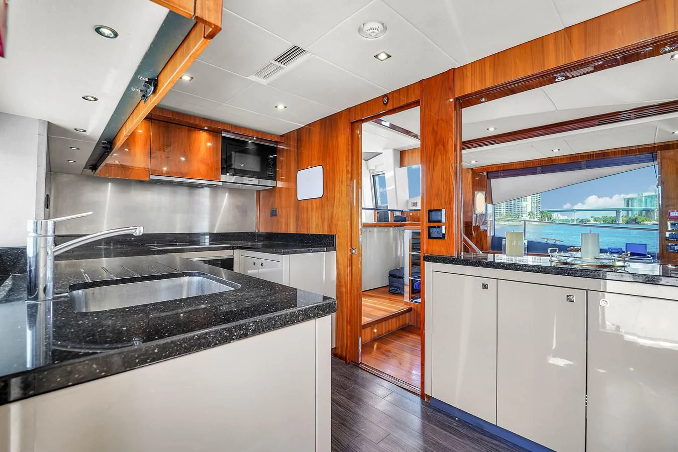 a kitchen with a large island aboard 92' SUNSEEKER 2016 Yacht for Sale