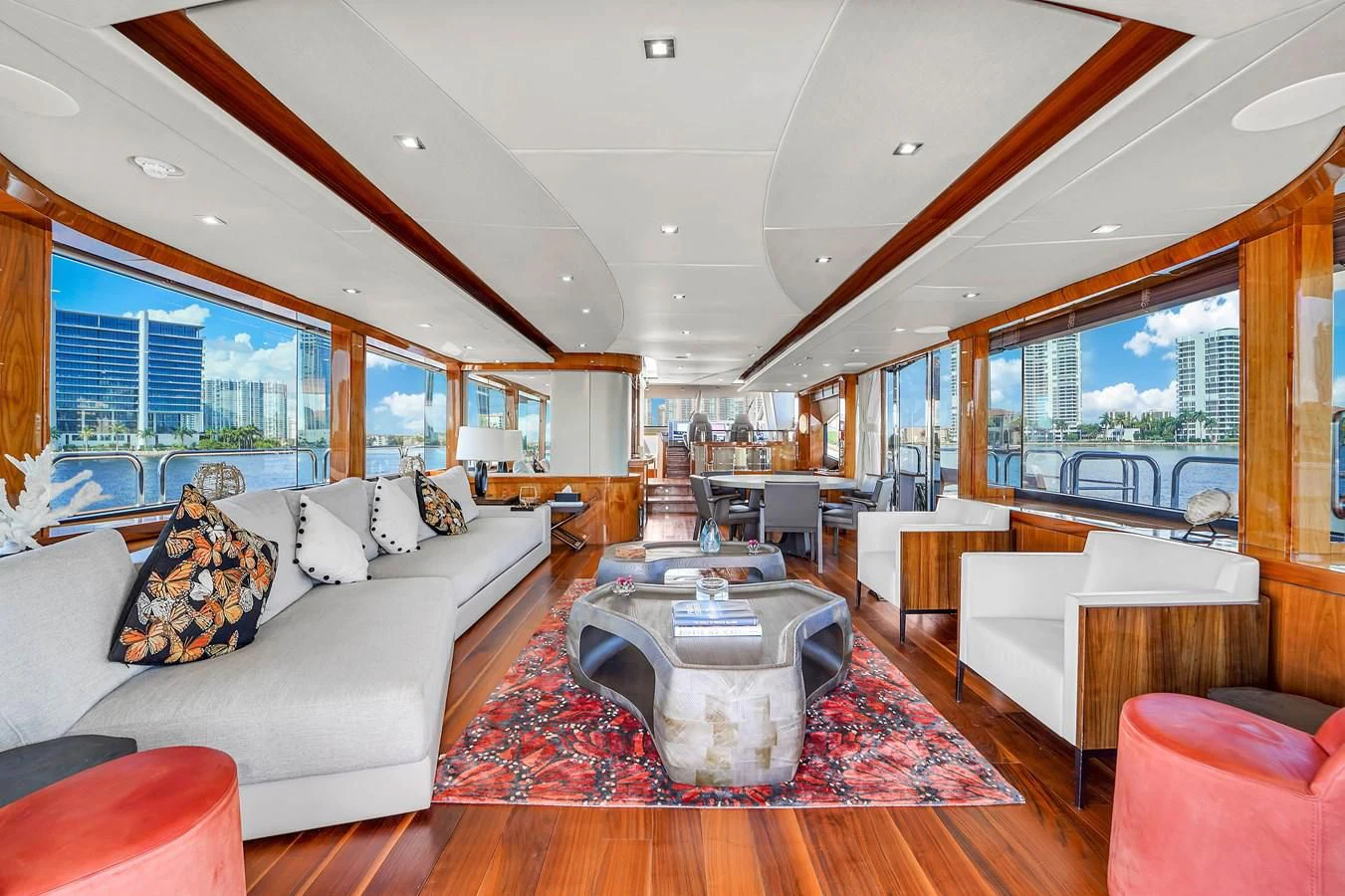 a living room with a large window aboard 92' SUNSEEKER 2016 Yacht for Sale