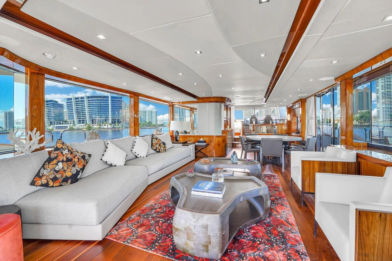 a living room with a large window aboard 92' SUNSEEKER 2016 Yacht for Sale