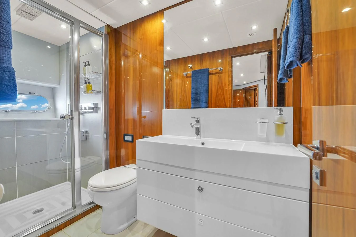 a bathroom with a glass shower aboard 92' SUNSEEKER 2016 Yacht for Sale