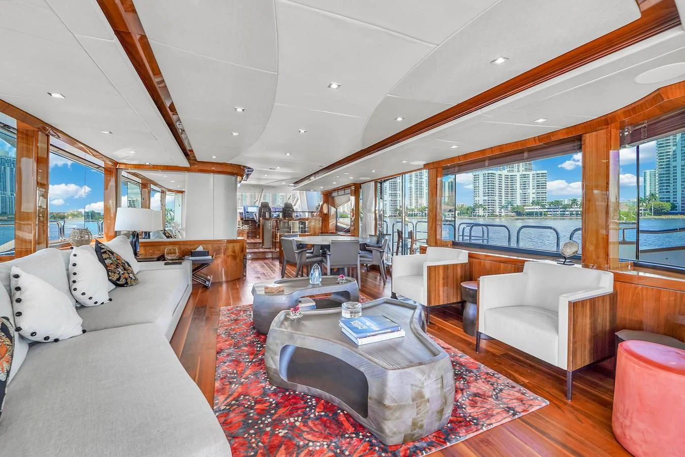 a living room with a large window aboard 92' SUNSEEKER 2016 Yacht for Sale