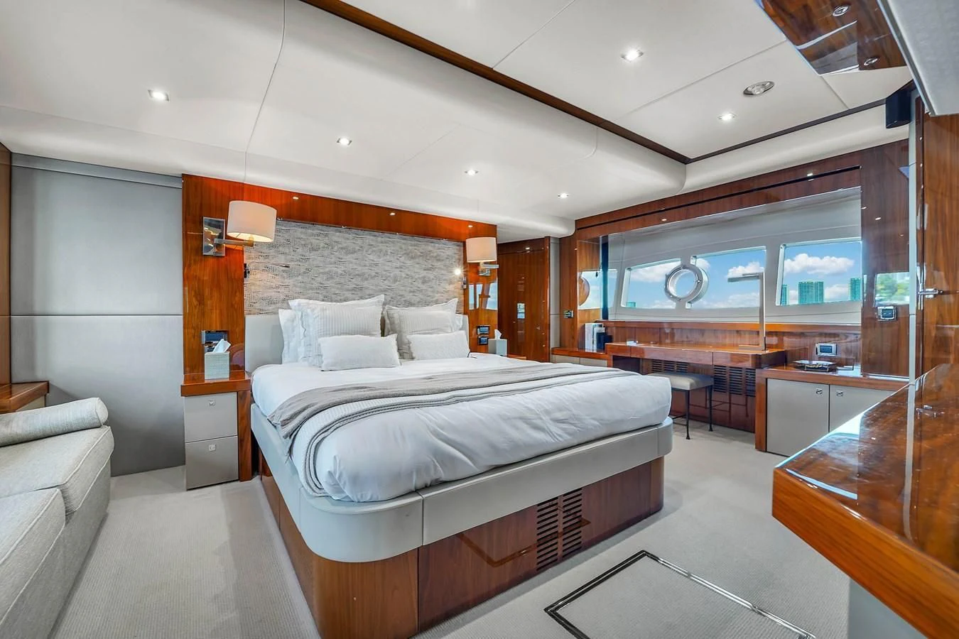 a bedroom with a bed and a desk aboard 92' SUNSEEKER 2016 Yacht for Sale