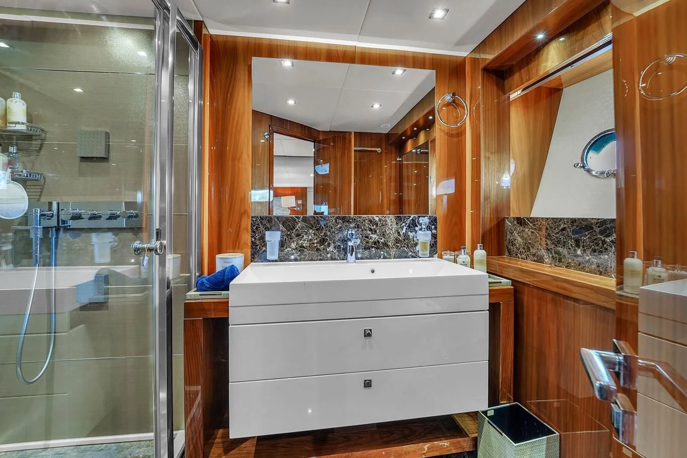 a bathroom with a glass shower aboard 92' SUNSEEKER 2016 Yacht for Sale