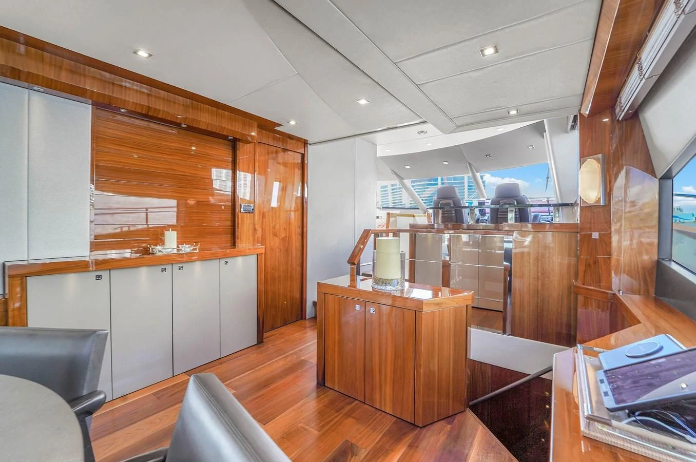 a kitchen with wooden cabinets aboard 92' SUNSEEKER 2016 Yacht for Sale