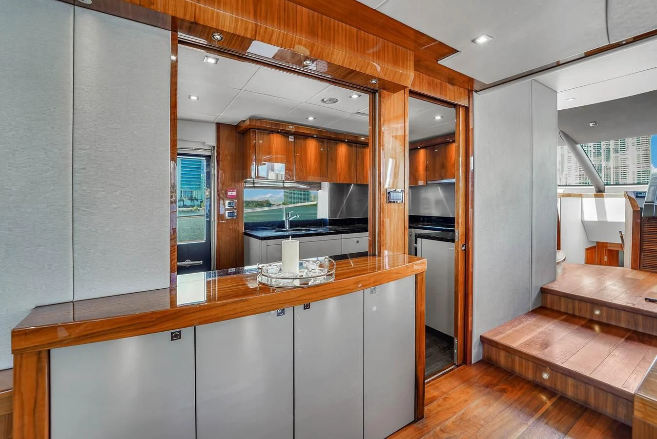 a kitchen with a large mirror aboard 92' SUNSEEKER 2016 Yacht for Sale