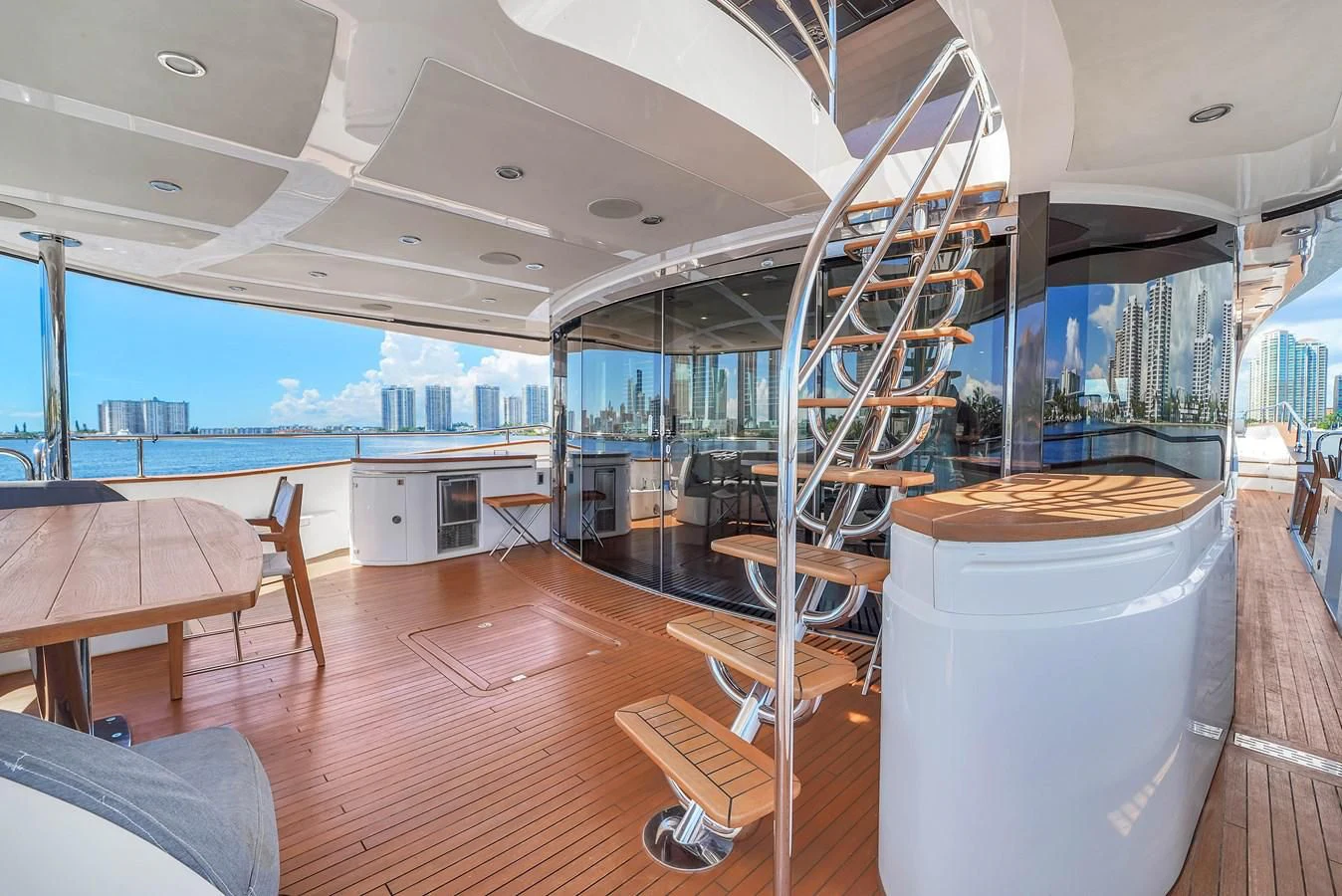 a large room with a table and chairs and a large window aboard 92' SUNSEEKER 2016 Yacht for Sale