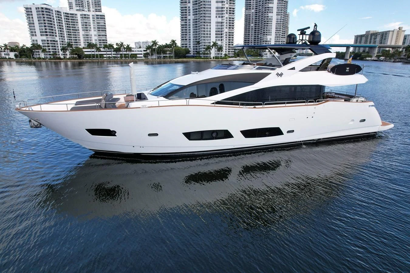 a white boat in a body of water aboard 92' SUNSEEKER 2016 Yacht for Sale