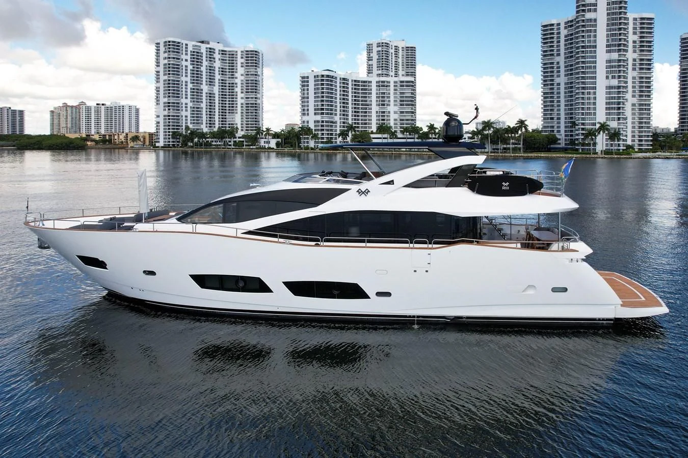 a white boat on a body of water aboard 92' SUNSEEKER 2016 Yacht for Sale