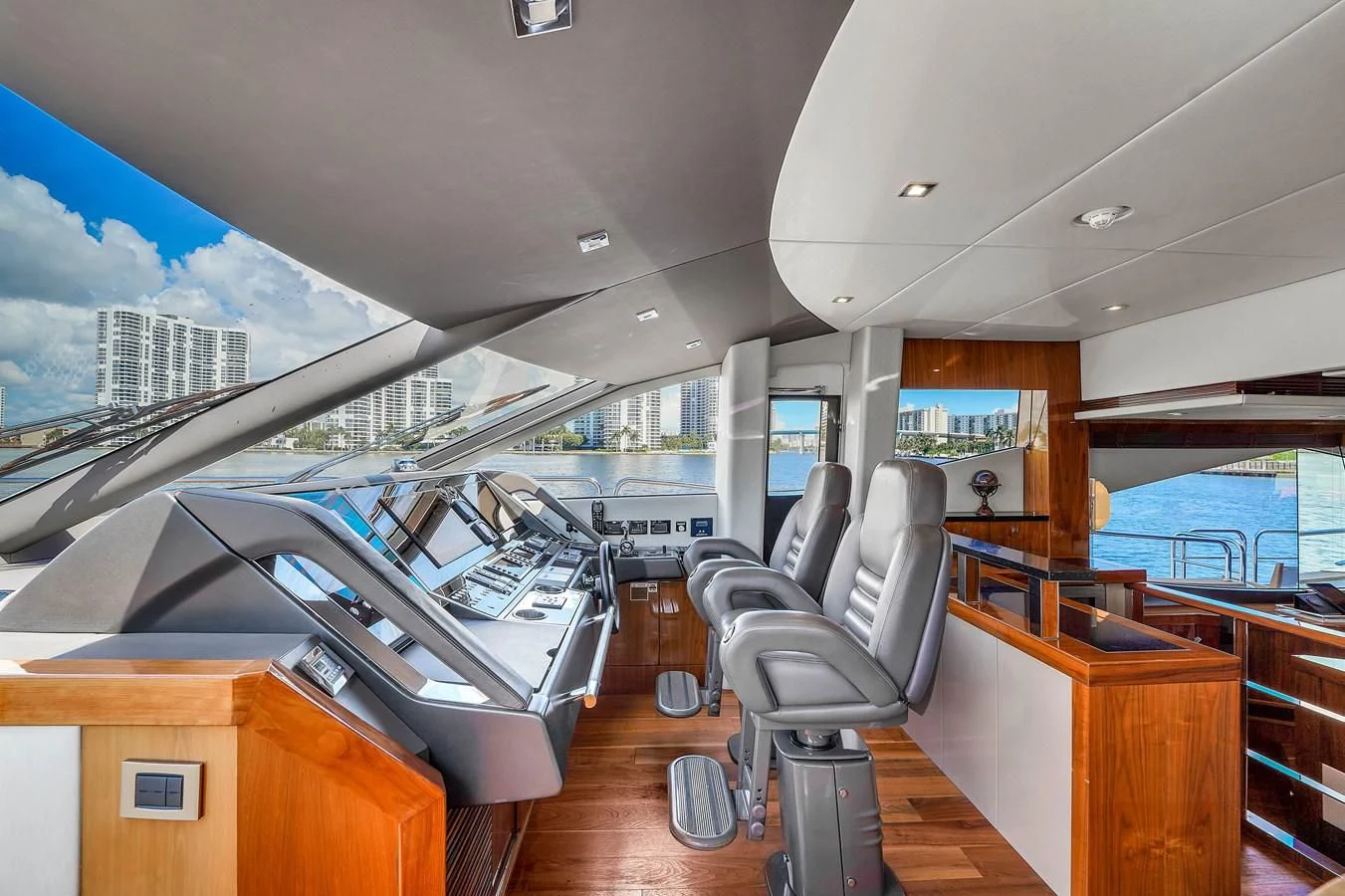 a room with a large pool table and chairs aboard 92' SUNSEEKER 2016 Yacht for Sale